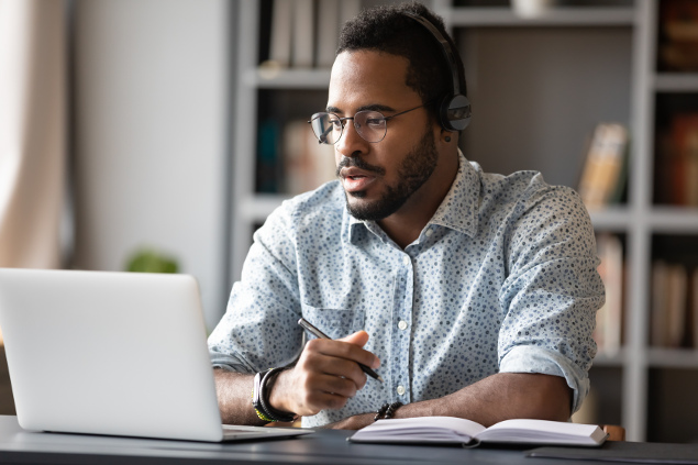 Focussed man studying online